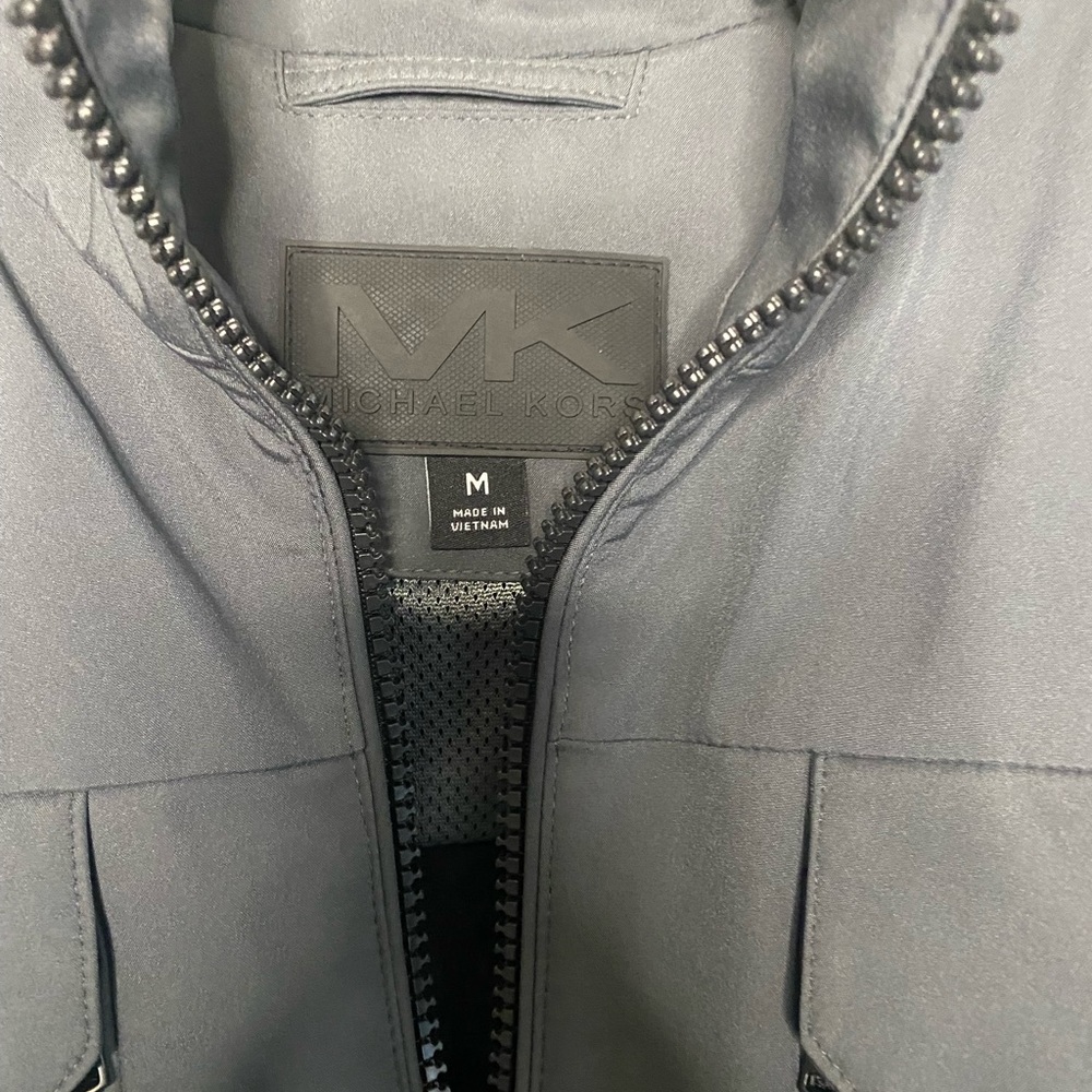 Men Michael Kors jacket. Dark grey black zipper. Medium. Brand new with tags.